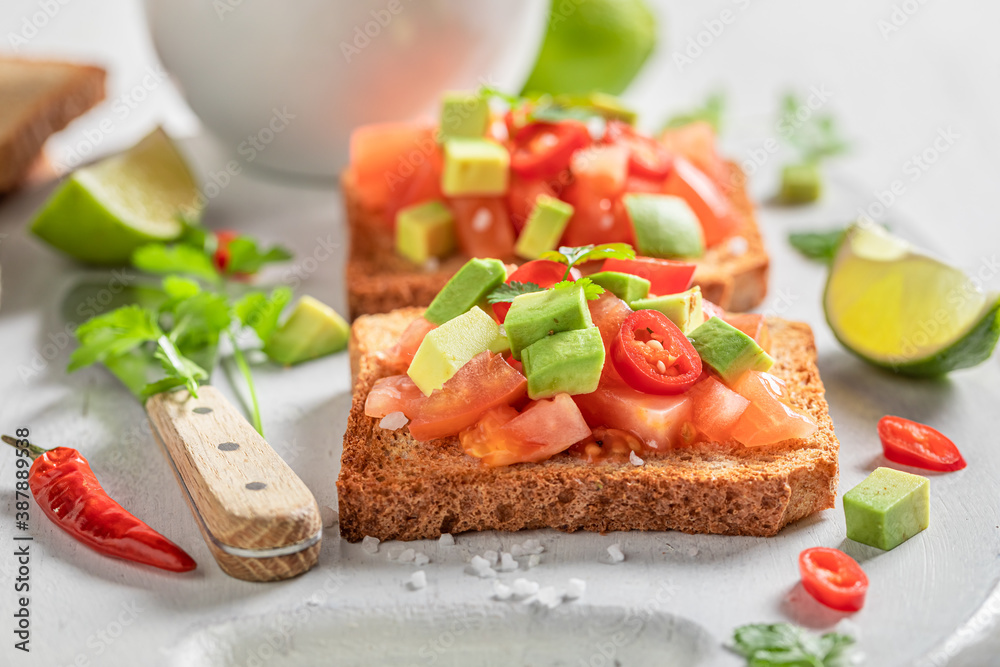 Vegetarian Toast with tomatoes, avocado and coriander