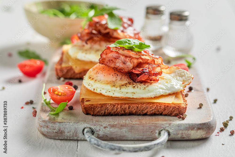 Unhealthy toast with egg, cheese and bacon