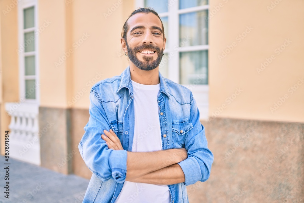 Young middle eastern man smiling happy walking at the city.