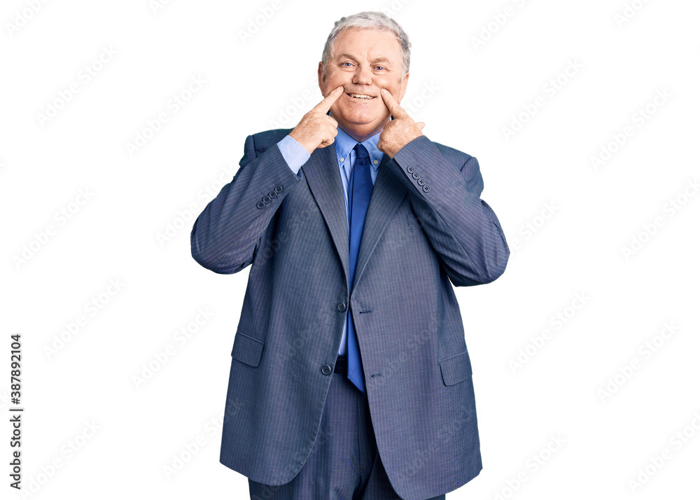 Senior grey-haired man wearing business jacket smiling with open mouth, fingers pointing and forcing cheerful smile Senior grey-haired man wearing business jacket smiling with open mouth, fingers pointing and forcing cheerful smile