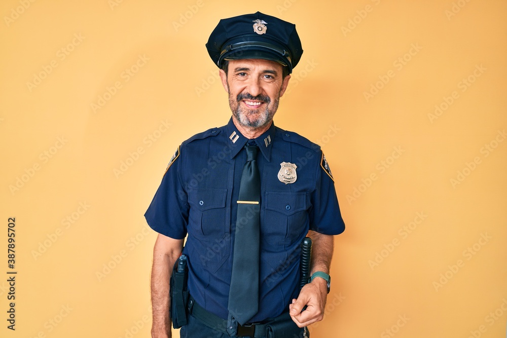 Middle age hispanic man wearing police uniform with a happy and cool smile on face. lucky person. Middle age hispanic man wearing police uniform with a happy and cool smile on face. lucky person.