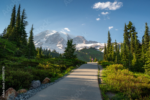 Hiker in the far distance on the Myrtle Falls waterfall trail in the Paradise Area of Mount Rainier National Park photo