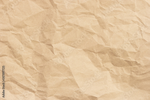 Brown crumpled paper texture background with space for design.