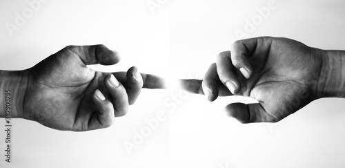 two hands holding each other