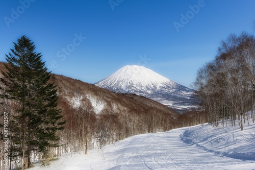 winter landscape road leading to Mount Yotei Japan covered with snow