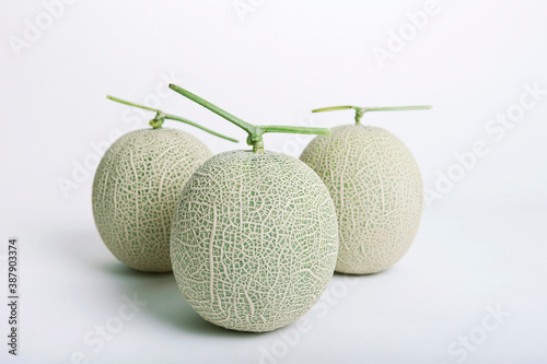 three melons on white background