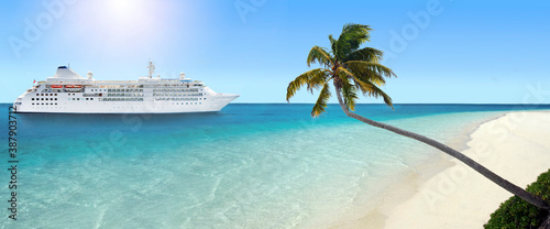 Cruise ship arriving at tropical beach