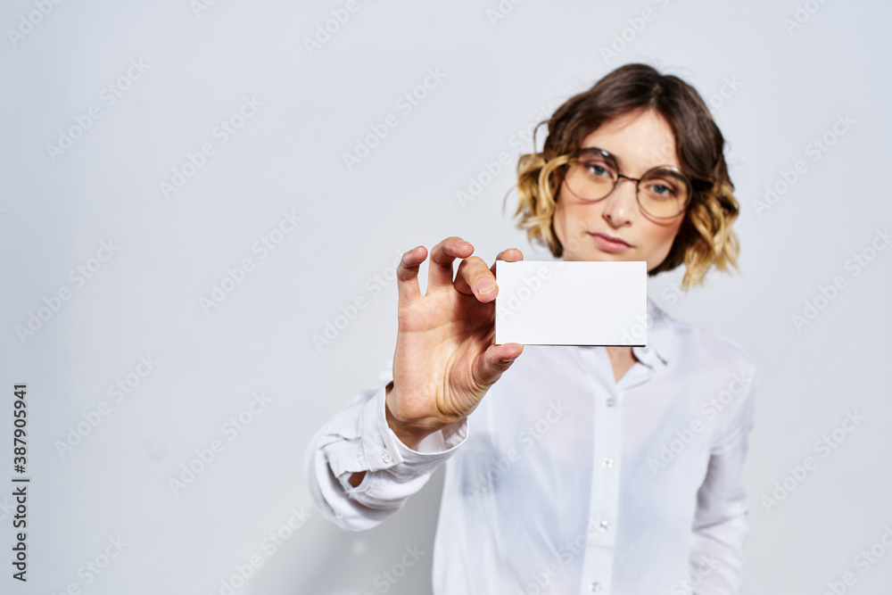 Business woman with card in hand light background credit card mockup Business woman with card in hand light background credit card mockup