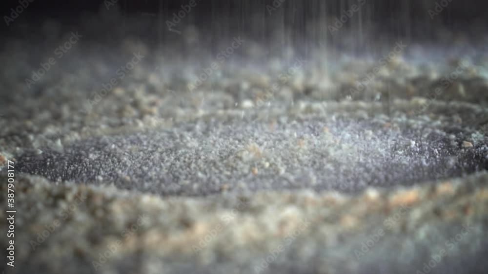 Breadcrumbs and spices mixed together pours into board Breadcrumbs and spices mixed together pours into board