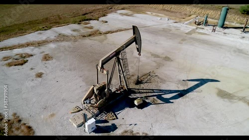 Active Texas Oil Derrick Pumping photo