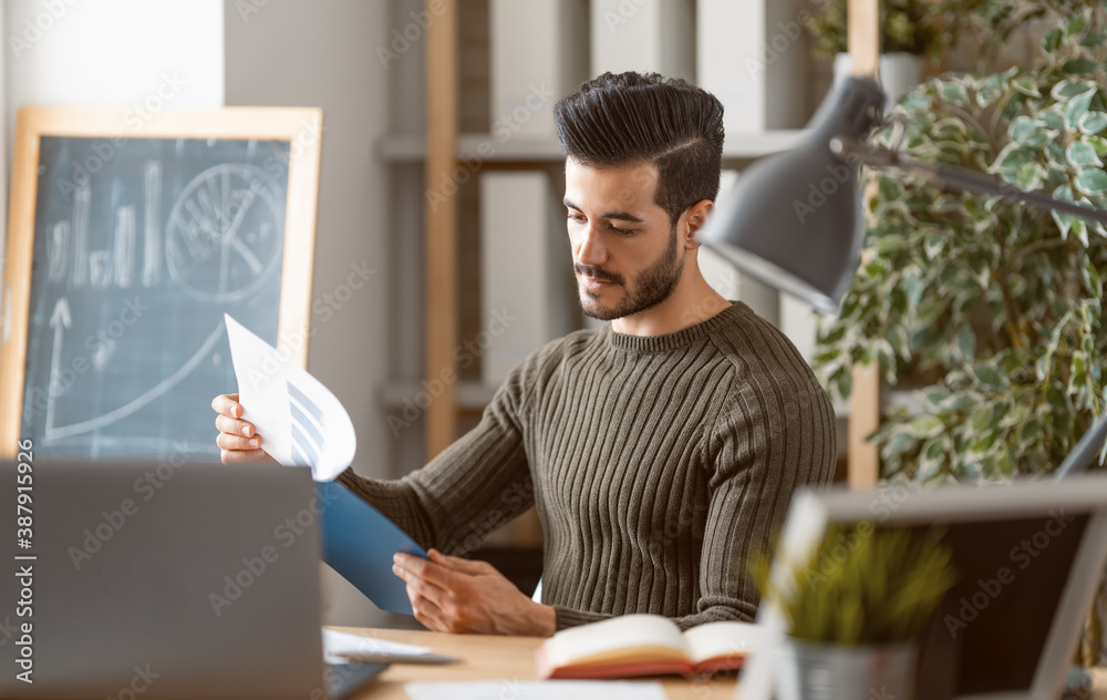 man working on a laptop at home man working on a laptop at home