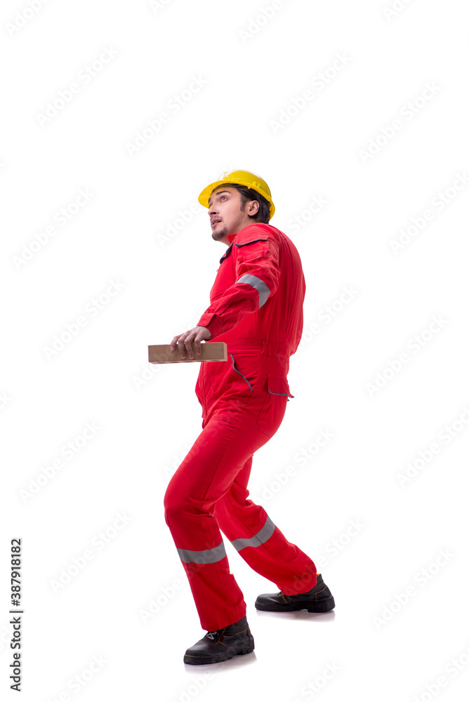 Young male mason with brick isolated on white Young male mason with brick isolated on white