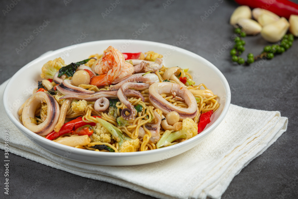 Thai food; stir-fried instant noodles with seafood and variety vegetable