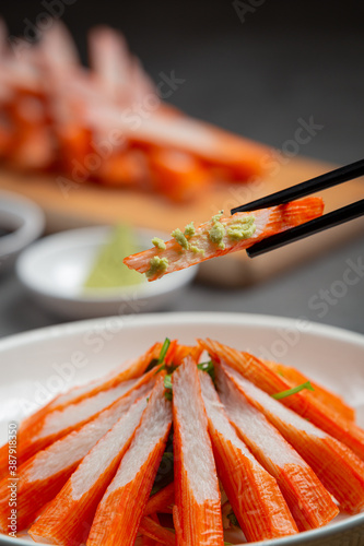 slides fresh crab sticks with wasabi and sauce