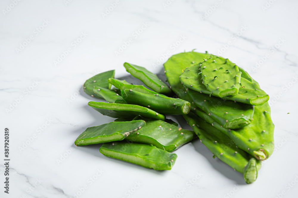 Fresh aloe vera, cut into pieces, put on a white floor Fresh aloe vera, cut into pieces, put on a white floor