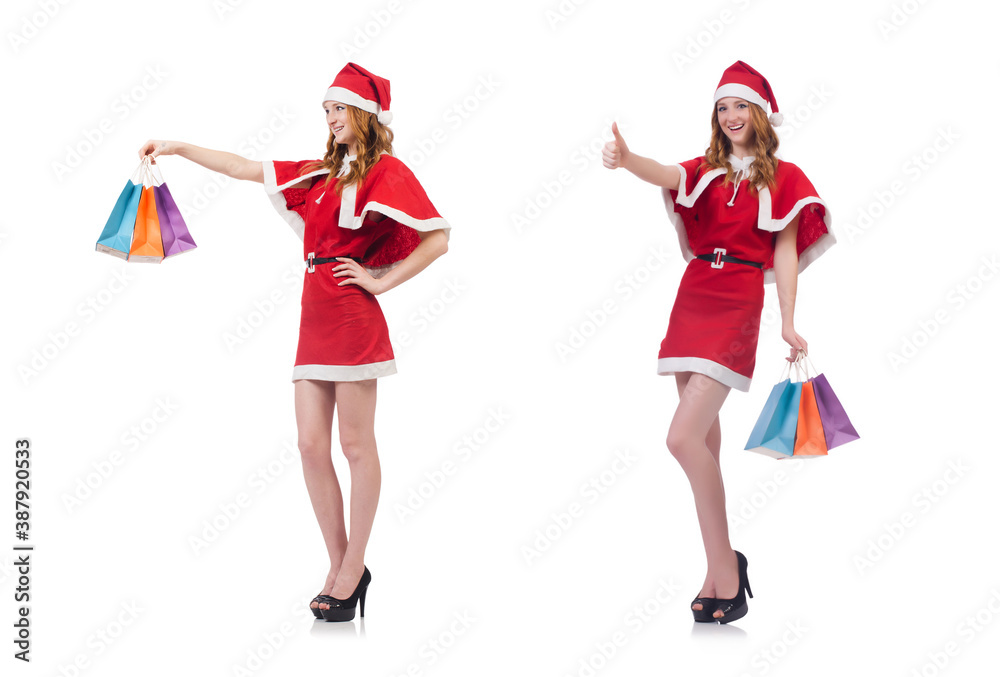 Young woman in red santa costume on white