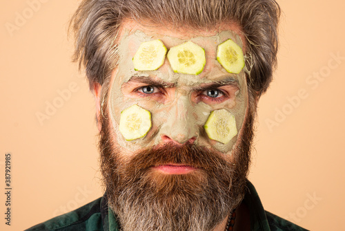 Man applying clay mask, Man with facial treatment.