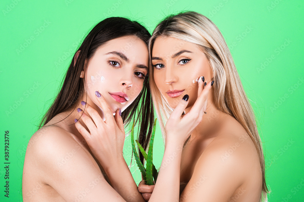 Sensual friends with facial masks. Beautiful young woman clean fresh bare skin. Beauty natural face skin care and health wellness, Facial treatment, Perfect skin. Face mask spa. Beauty salon. Sensual friends with facial masks. Beautiful young woman clean fresh bare skin. Beauty natural face skin care and health wellness, Facial treatment, Perfect skin. Face mask spa. Beauty salon.