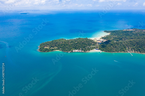 Long deserted beach with white sand and clear water. Aerial top view. island Koh Rong Samloem, Sihanoukville, Cambodia. This is a small island that attracts many vi. White sand beach and calm sea.