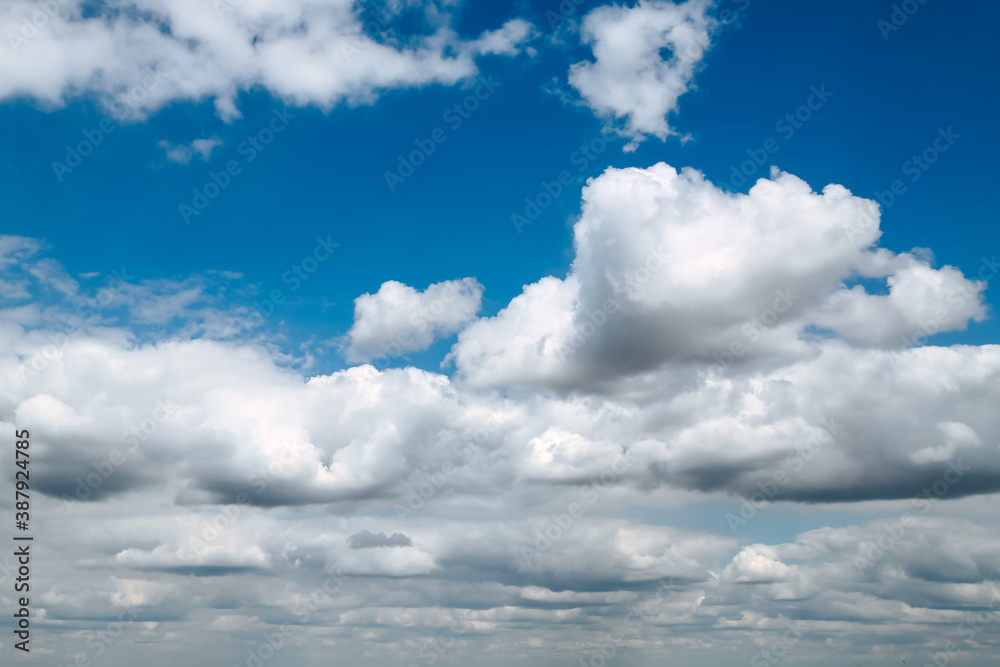 Blue clear sky with white fluffy clouds. Natural background Blue clear sky with white fluffy clouds. Natural background