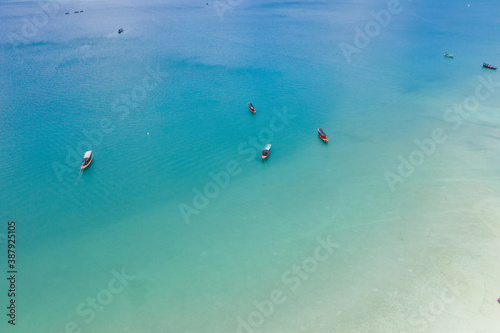 Long deserted beach with white sand and clear water. Aerial top view. island Koh Rong Samloem, Sihanoukville, Cambodia. This is a small island that attracts many vi. White sand beach and calm sea. © Nhut