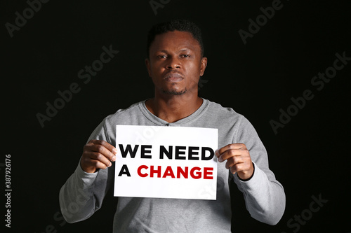 African-American man holdin...