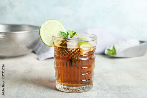 Photography Glass of tasty Cuba Libre cocktail on table