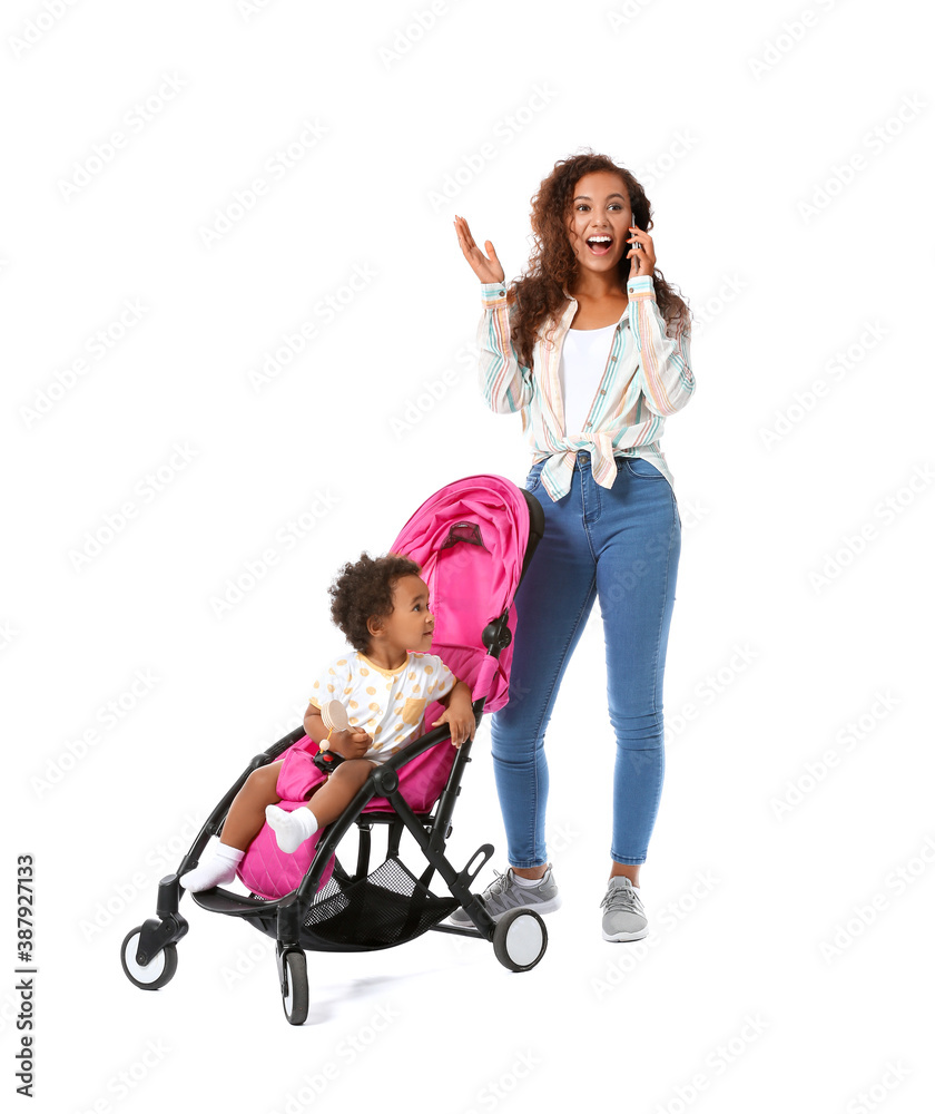African-American woman and her cute baby in stroller on white background African-American woman and her cute baby in stroller on white background