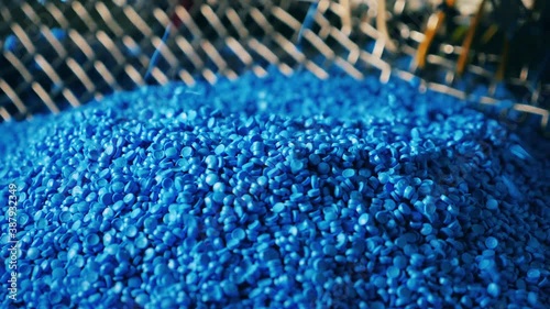 Blue plastic granules raining down