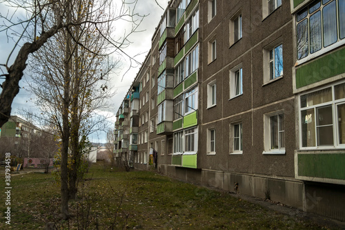 Soviet architecture. Ust-Kamenogorsk (Kazakhstan) Apartment buildings. Soviet architectural style. Residential buildings. Soviet built multistory apartment buildings. Grunge urban landscape. Autumn © Lucky Photographer