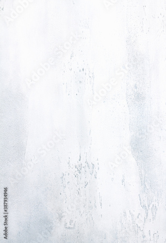 Light blue grey white textured concrete background with light base darker in the recesses. Abstract texture for graphic design or wallpaper