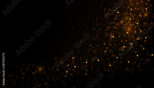Vector abstract background with golden particles on black. Decorative backdrop with sparkling magic lights and glittering effect. 
