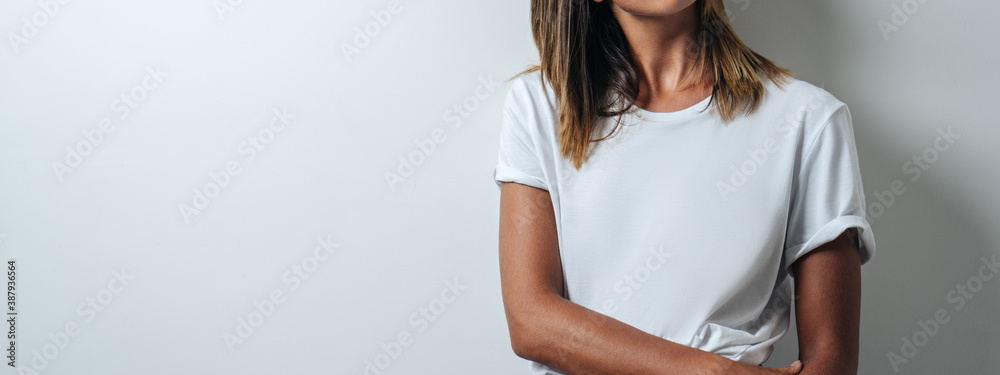 Young and pretty woman in white blank t-shirt wearing glasses, empty ...