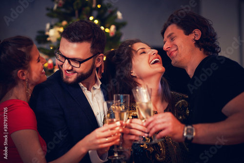Two beautiful young couples having fun at New Year's Eve Party