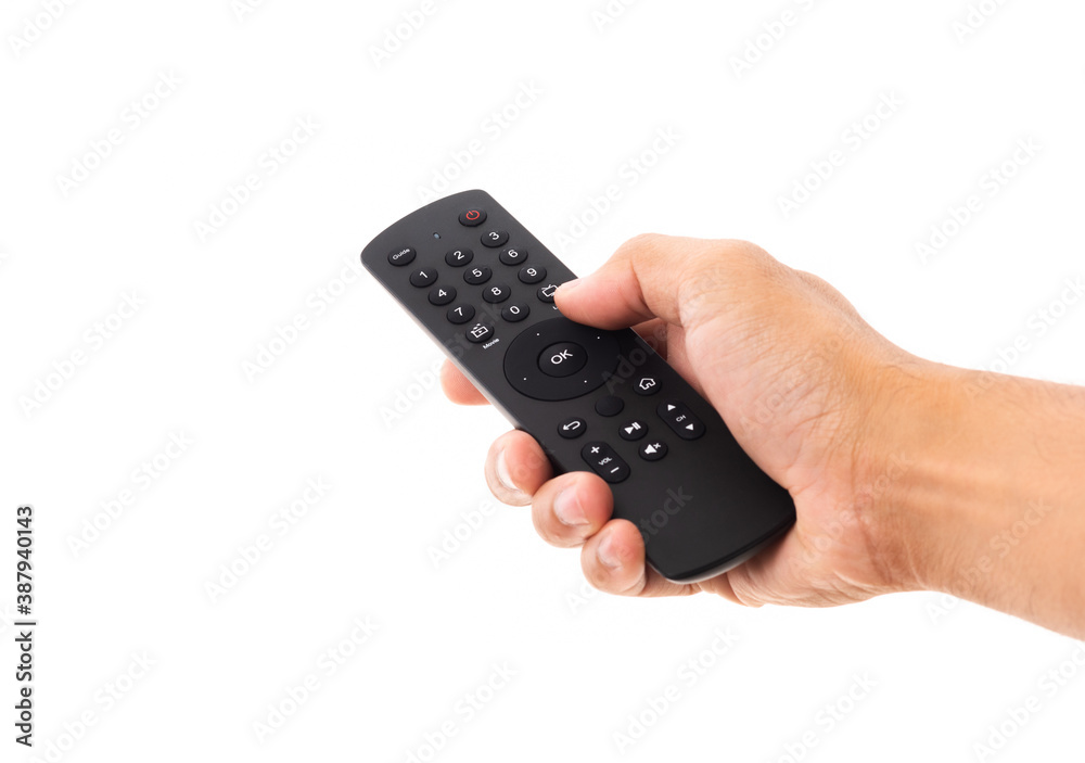 Hand holding television and audio remote control panel, studio shot isolated on over white background, Television wall broadcasting concept Hand holding television and audio remote control panel, studio shot isolated on over white background, Television wall broadcasting concept