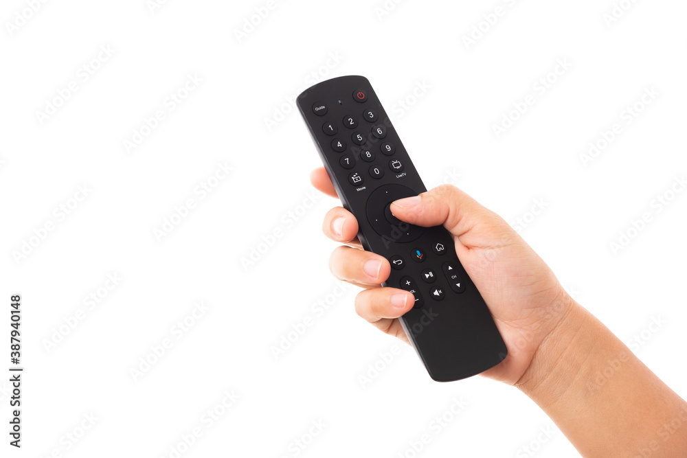 Hand holding television and audio remote control panel, studio shot isolated on over white background, Television wall broadcasting concept Hand holding television and audio remote control panel, studio shot isolated on over white background, Television wall broadcasting concept