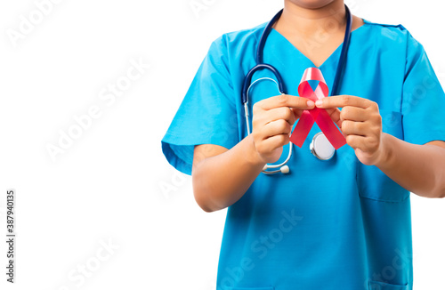 Woman nurse in clinic uniform holding support HIV AIDS awareness red ribbon on hands in studio shot isolated on over white background, Healthcare and medicine, World aids day concept