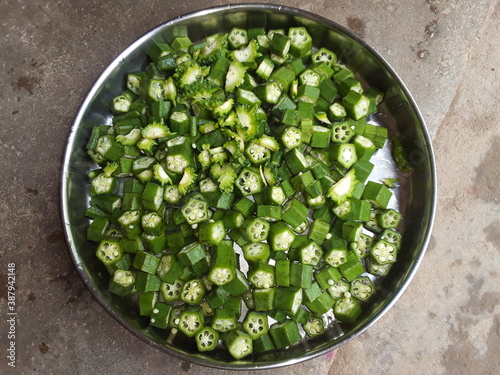 LADYFINGER / OKURA (CUT) vegetables .the Indian vegetables food kitchen decorating.Okra is a vegetable.  Its tree is about 1 meter long.  In Benares it is called 'Ram Taroi' and in Chhattisgarh  photo