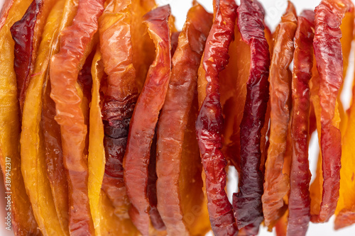 slices of dried plum on a white background. dried fruits. eco. macro.