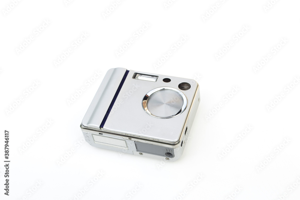 Compact digital camera on white background.