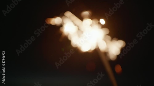 Close up of sparkler at night, New Years Eve or Independence Day celebration photo