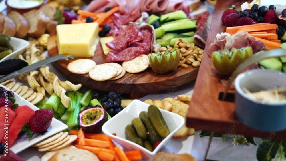 Table covered in abundant gourmet food banquet, close up slide left reveal Table covered in abundant gourmet food banquet, close up slide left reveal