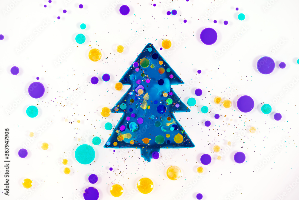 Fluid art texture. Abstract new year background. Liquid acrylic artwork with flowing bubbles. Mixed paints for backdrop or poster. Christmas tree. Overflowing colors with glitters Fluid art texture. Abstract new year background. Liquid acrylic artwork with flowing bubbles. Mixed paints for backdrop or poster. Christmas tree. Overflowing colors with glitters