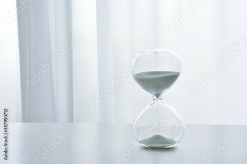 Hourglass on a white desk