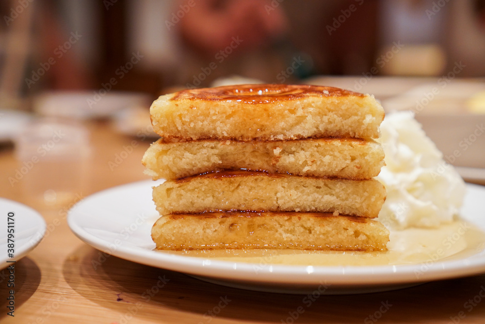 Cut in a half Pancake Stack. A fluffy pancake with maple syrup. (close up) Cut in a half Pancake Stack. A fluffy pancake with maple syrup. (close up)