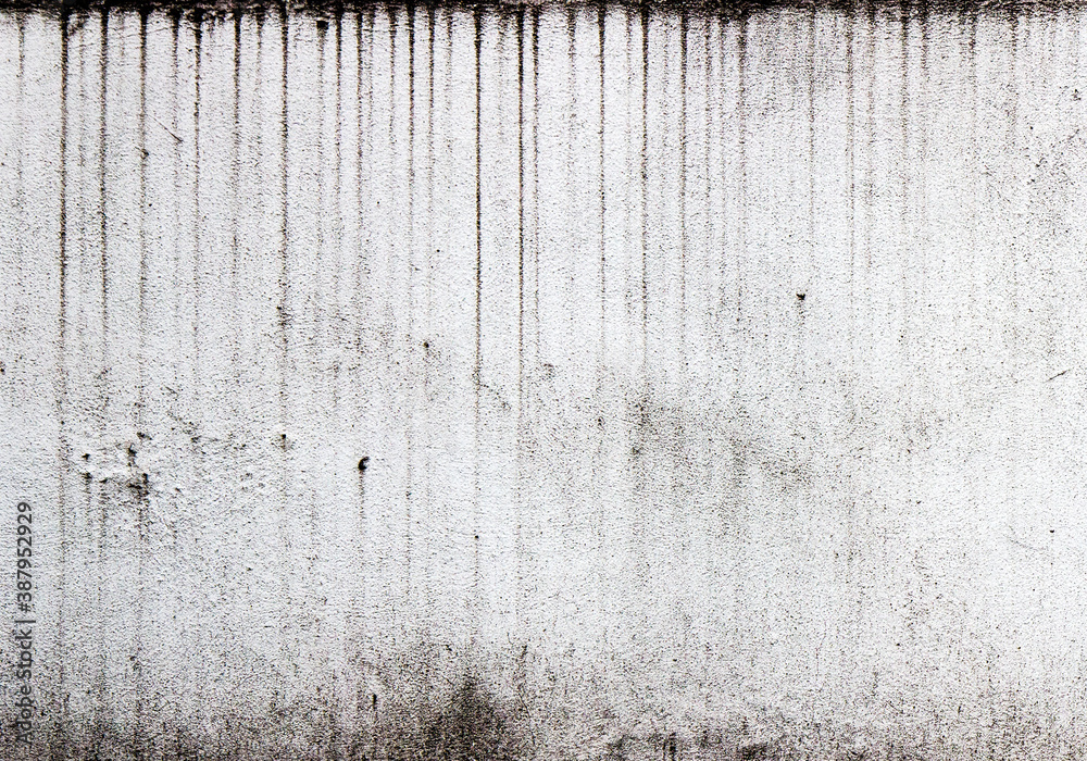 Vertical streaks of dirt on a white textured wall - obrazy, fototapety, plakaty 