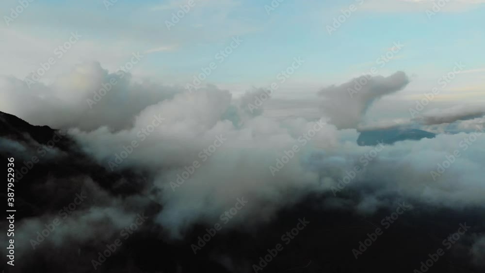 Aerial drone image of the clouds and Mount Baldo during sunset.