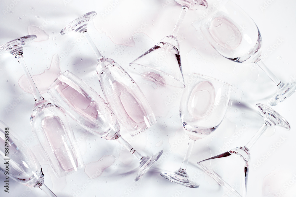 Glasses of champagne and alcohol drinks on white table background Glasses of champagne and alcohol drinks on white table background