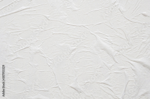 Blank white crumpled and creased paper poster texture background