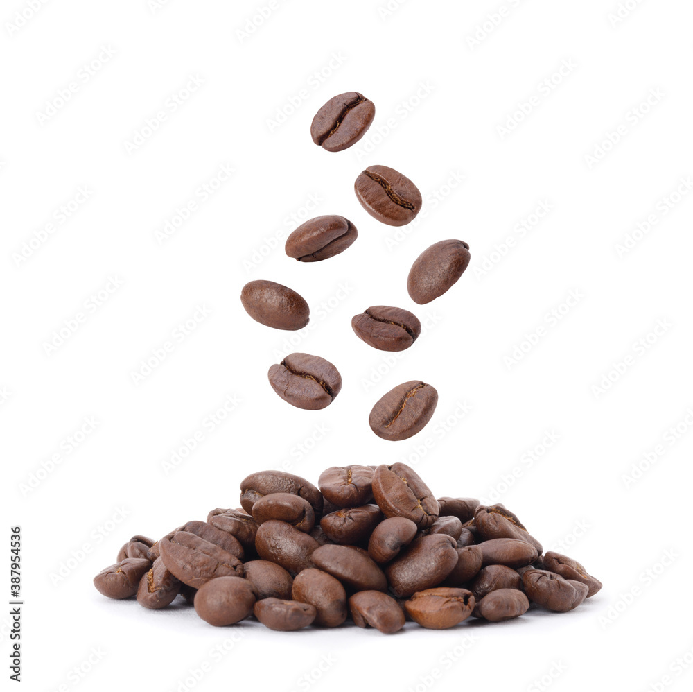 Flying whirl roasted coffee beans in the air studio shot isolated on white background, Healthy products by organic natural ingredients concept Flying whirl roasted coffee beans in the air studio shot isolated on white background, Healthy products by organic natural ingredients concept